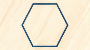 Esagono disegnato su superficie in legno chiaro
