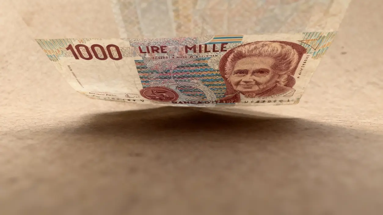 Vecchia banconota da mille lire con il ritratto di Maria Montessori su fondo neutro